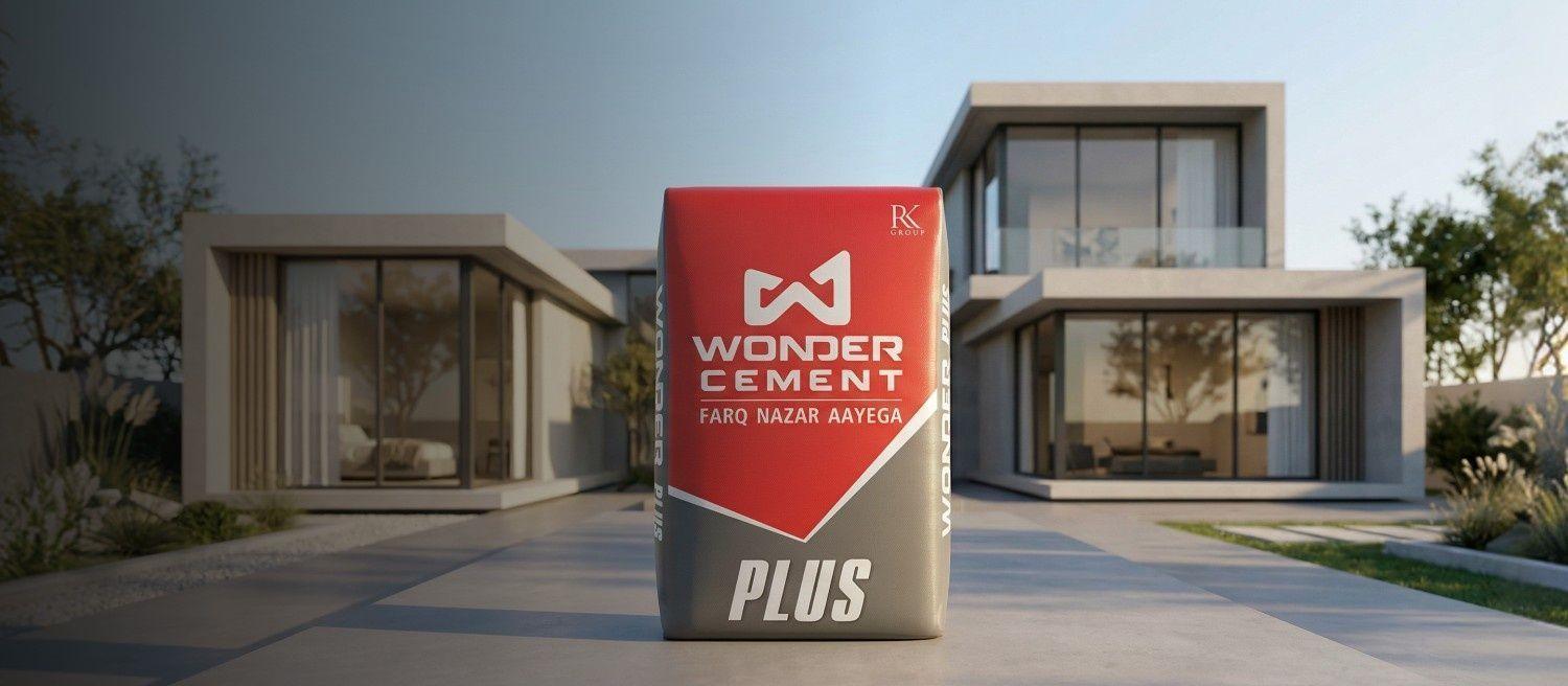 Wonder Cement Plus bag displayed prominently in front of two modern, luxurious houses.