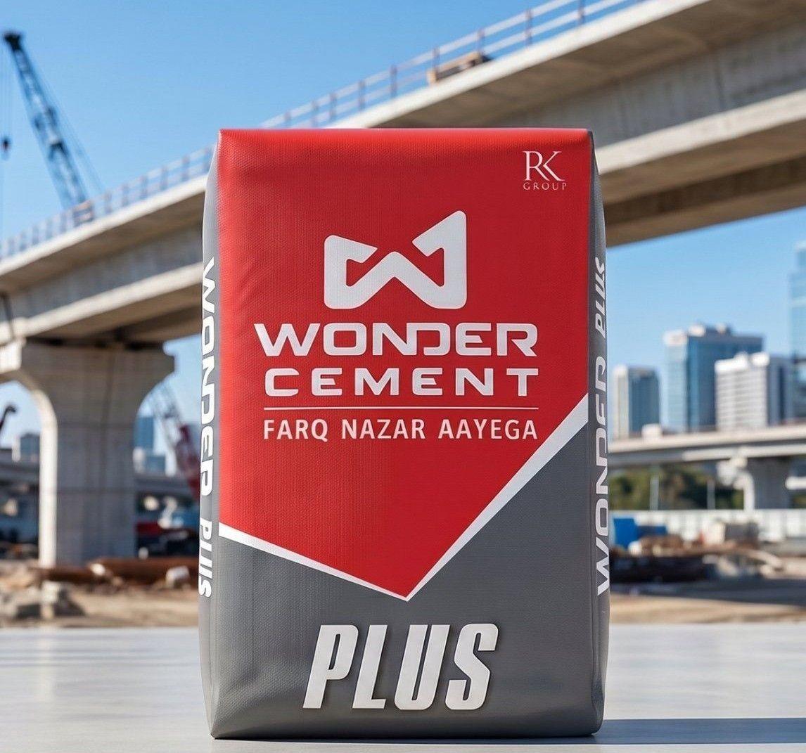 Wonder Cement Plus bag with red and grey design at a construction site with a bridge.